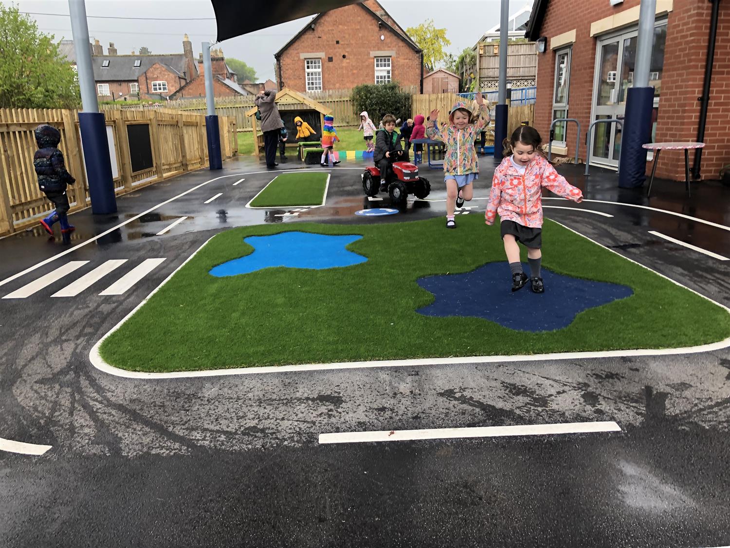 Children playing in the rain