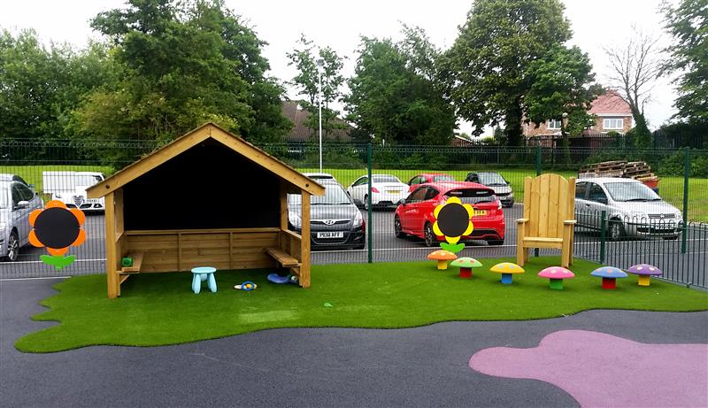 Playhouse and Story telling circle installed at a school with special education needs