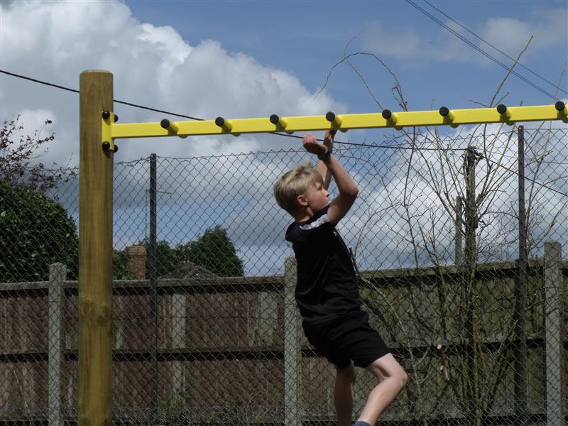 Monkey bars are a great outdoor activity for young children and can be found in playgrounds