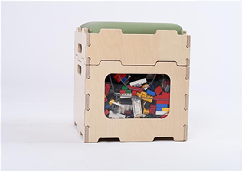 One Stack and Sit stool filled with lego blocks inside it with a sage green cushion on top 