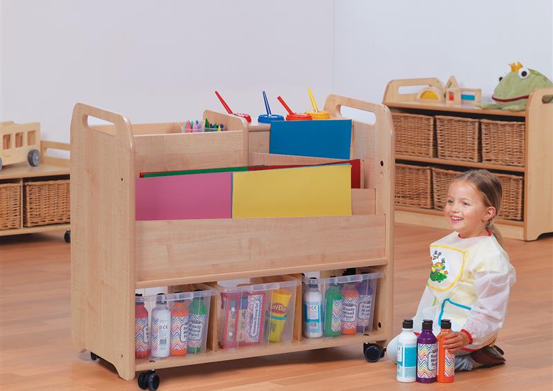 A young girl is choosing arts and crafts supplies from the Double-sided Creative Unit.