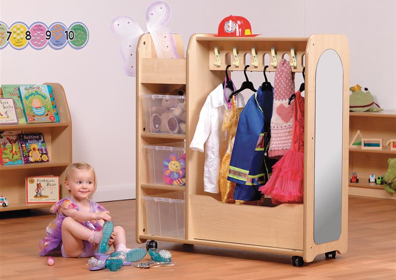 The Mobile Dressing Up Trolley is in a classroom with various different outfits hung up on it.