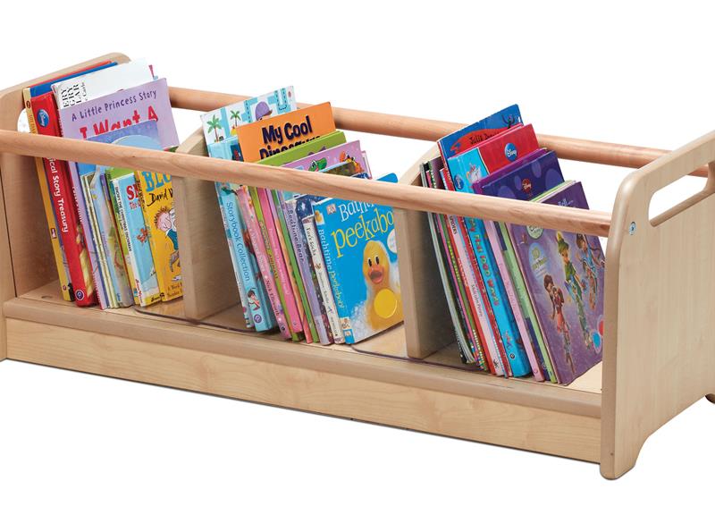 An wooden bookshelf on a white background, packed with colourful books